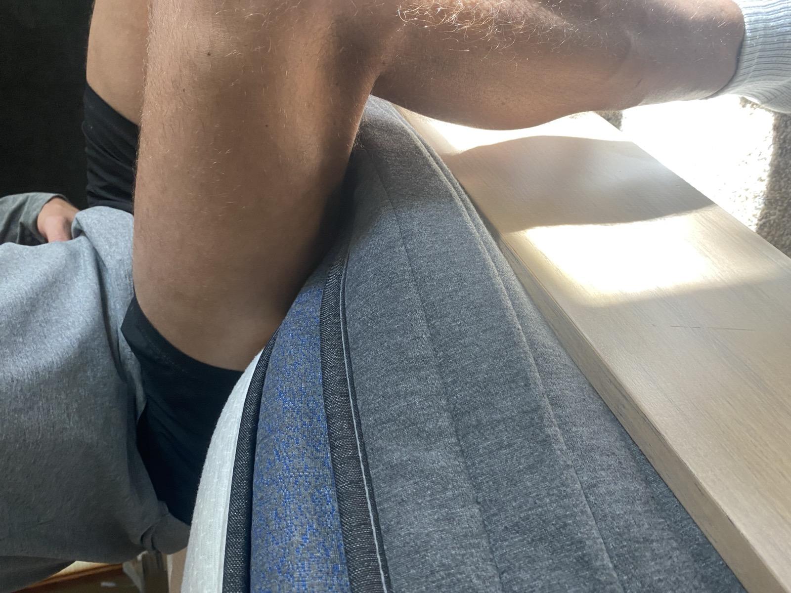 Testing Helix Midnight Luxe edge support by sitting